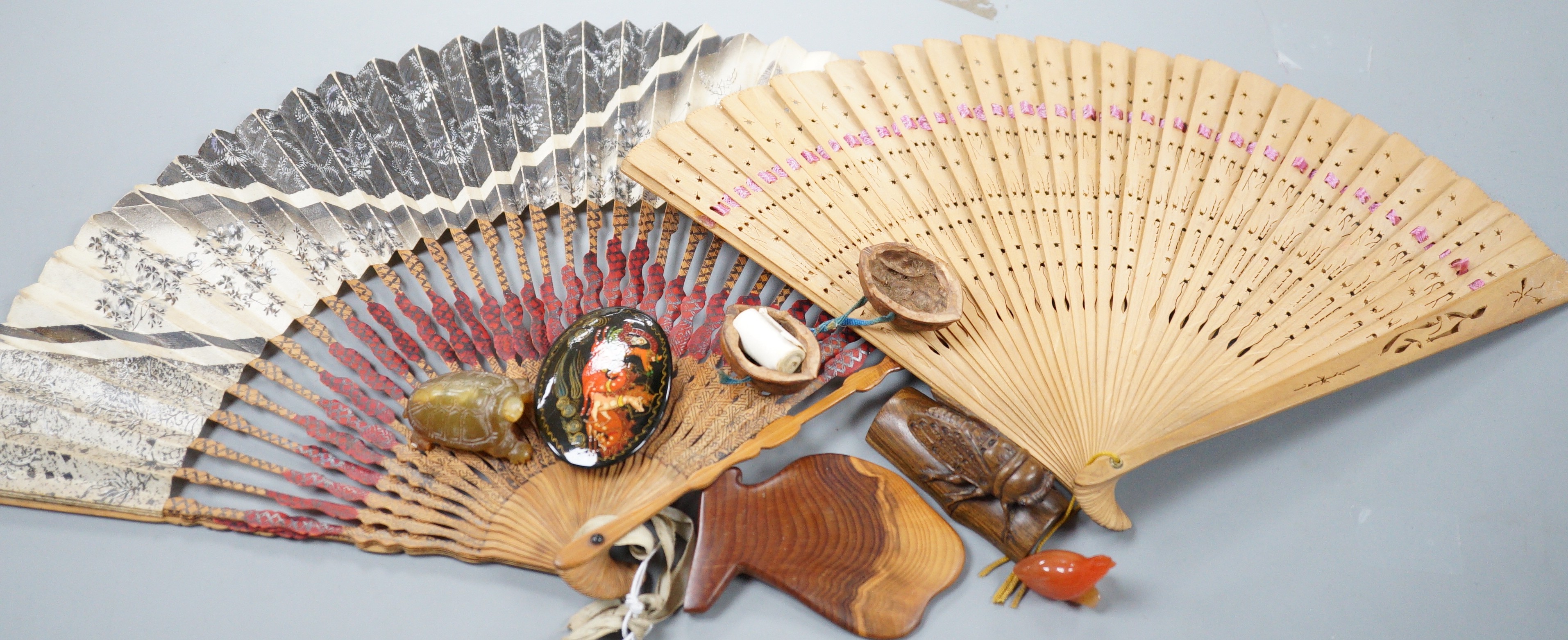 A Japanese hardwood cicada netsuke, two hardstone pieces and sundries